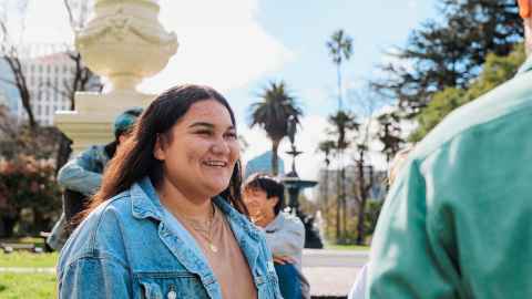 Where your new journey starts Happy student in front to Fale