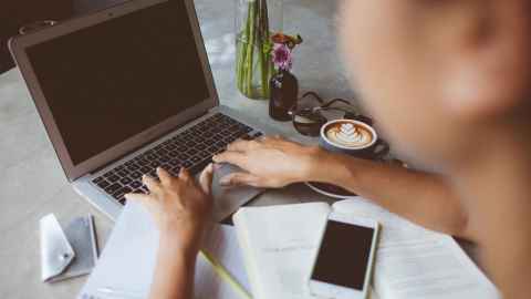 person typing on laptop