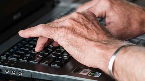 Fingers typing on keyboard