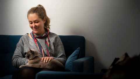 Emma Newborn with her cat Governor Grey in Old Government House.