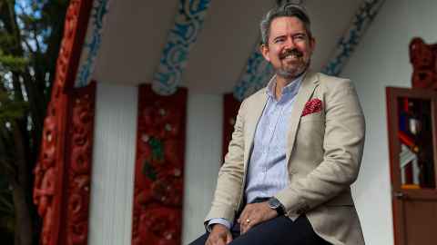 Geremy Hema is a kaiārahi for UniServices. Pictured sitting at Waipapa marae.