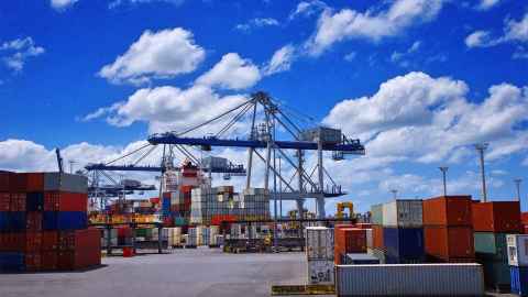 A crago ship loaded with containers is pictured at the Tport of Auckland: Most goods that pass through Auckland's terminal are destined for Auckland. It makes no sense to ship them somewhere else and then have to transport them back to Auckland.