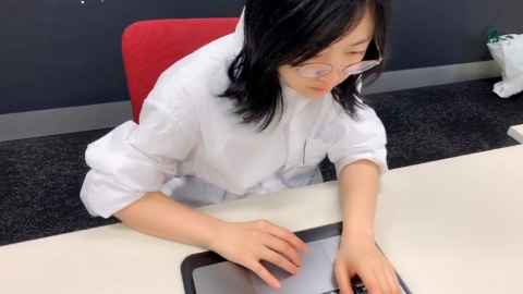 Business Masters student Mila Lee at work