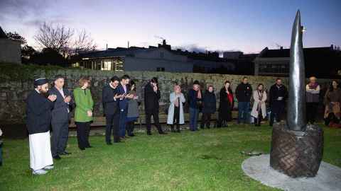 Guests at the dawn blessing for the unveiling of the memorial