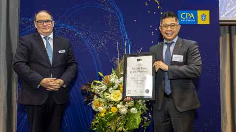 Photo of Mitchell Pham receiving his award