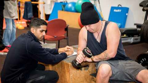 Ethan Tuwai exercises at the Health and Rehabilitation Clinic