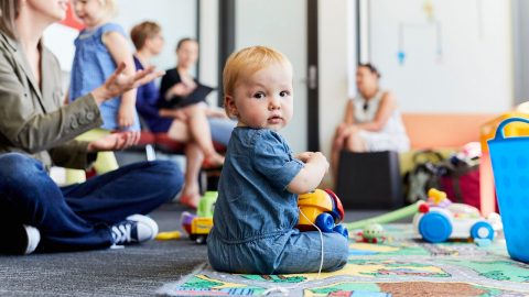 A baby playing with toys
