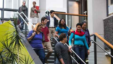 Adult students walking down steps in FMHS