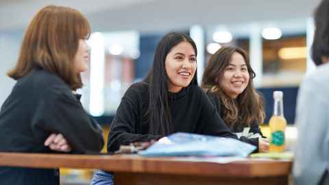 Smiling international students in a classroom
