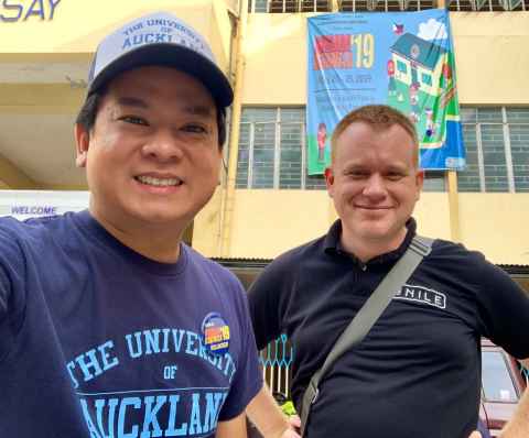 Alumni helping with maintenance and clean up duties at Roman Magsaysay High School during “Brigada Eskwela” or school brigade 2019, Philippines.