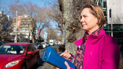 Professor Jennifer Salmond uses a hand-held particle sensor to measure air quality in urban areas. Photo: Elise Manahan