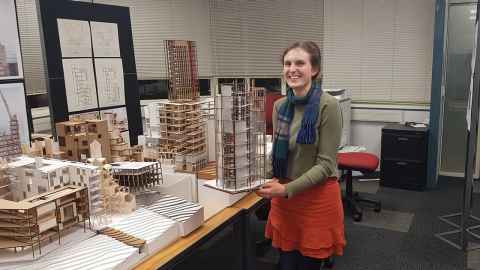 Carys Collins with a partially completed model.