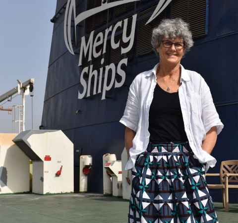 Judy Harding and the ship she's working on in Africa. 