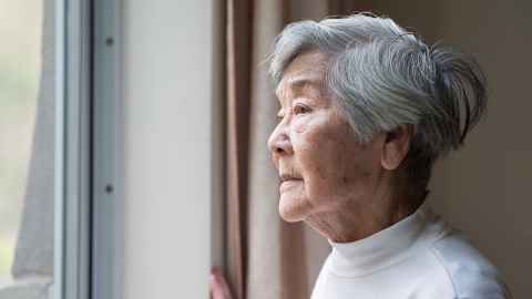 Older woman at window