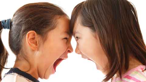 Two girls arguing.