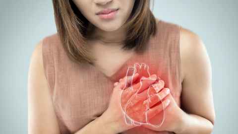 woman-holding-heart-in-discomfort