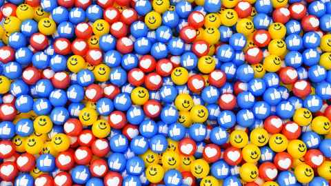 illustration of social media emojis such as hearts and thumbs up. 