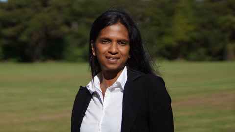 Research fellow Dr Komathi Kolandai, head and shoulders against green background.