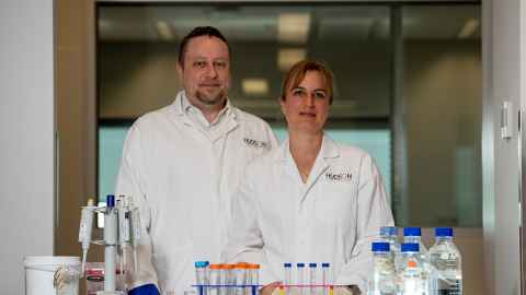 Professors Marcel and Claudia Nold in lab coats.