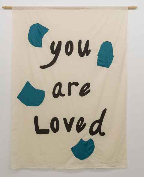 The 2018 textile banner, Reflections 1 shows the words You are Loved 