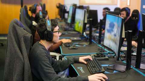 Students playing competitive e-sports in the E-sports Arena