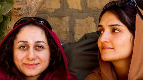Two smiling women in headscarf - Ghazaleh on right.