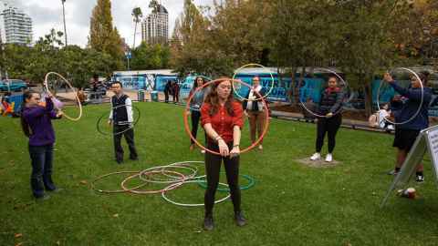 Students play in hula hoops