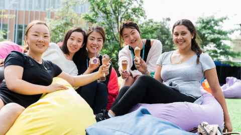 Students hanging out together eating ice cream