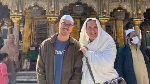 A photo of Brandon and the wonderful Bollywood teacher Dr. Gilles Chuyen at a Sufi Shrine.
